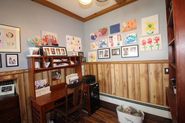 home office featuring dark wood-type flooring, wood walls, ornamental molding, and a baseboard heating unit