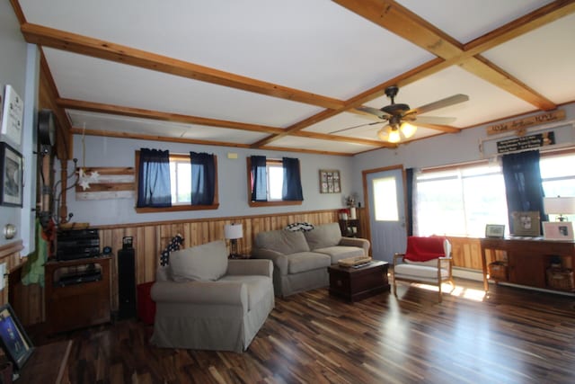 living room featuring wooden walls, coffered ceiling, dark wood-type flooring, and ceiling fan