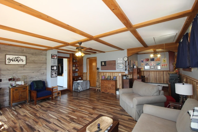 living room featuring wood walls, ceiling fan, coffered ceiling, beamed ceiling, and dark wood-type flooring