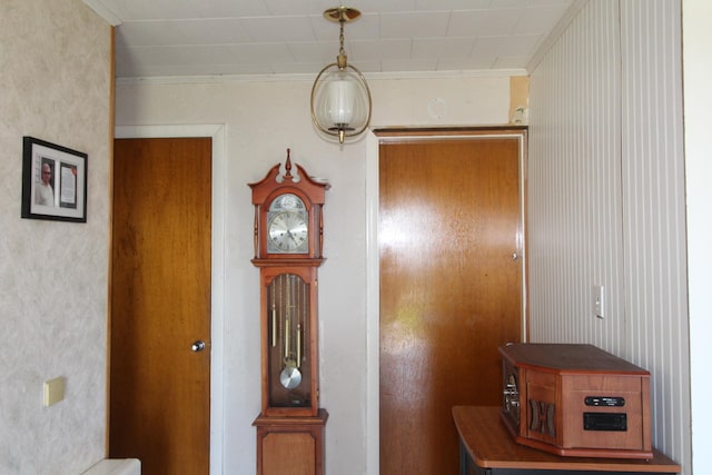 interior space with crown molding