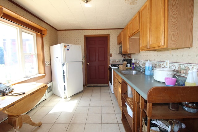 kitchen featuring sink, light tile patterned floors, electric range, and white refrigerator