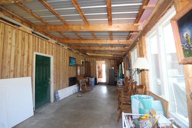 misc room featuring wooden walls