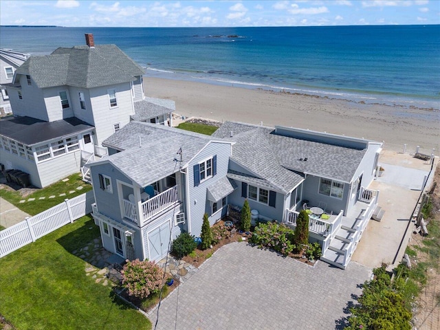 birds eye view of property with a view of the beach and a water view