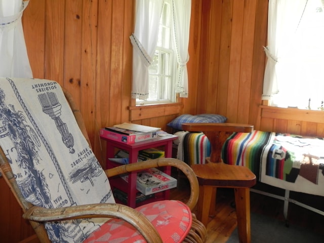 sitting room with wood walls