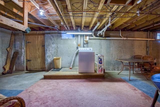 basement with washer / clothes dryer and carpet floors