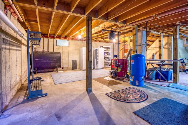 basement featuring white fridge