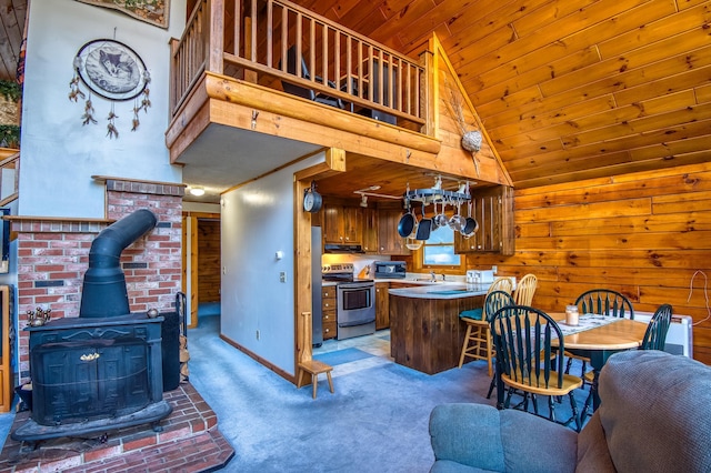 kitchen featuring light carpet, electric range, high vaulted ceiling, wooden ceiling, and a wood stove