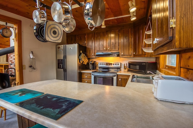 kitchen with kitchen peninsula, wood ceiling, sink, and appliances with stainless steel finishes