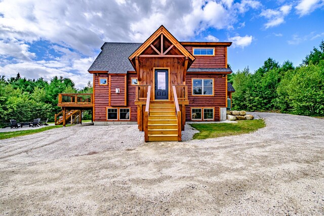 log cabin featuring a deck