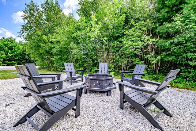 view of patio / terrace with an outdoor fire pit