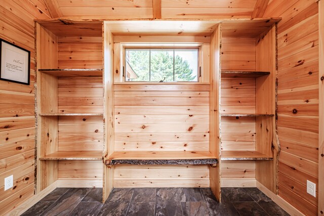 mudroom featuring wood walls and wood ceiling