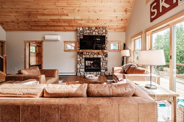 living room with a fireplace, vaulted ceiling, an AC wall unit, and a healthy amount of sunlight