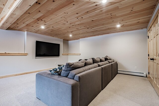 cinema with light carpet, a baseboard radiator, and wooden ceiling