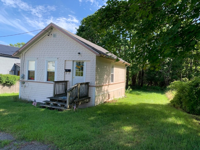 view of front of home with a front yard