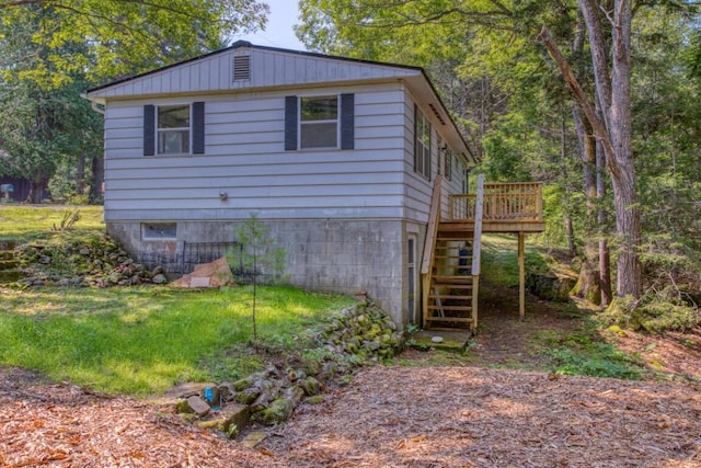 view of side of property with a deck