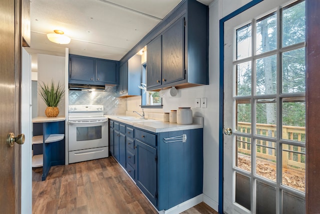 kitchen featuring dark hardwood / wood-style flooring, range with electric stovetop, sink, and plenty of natural light