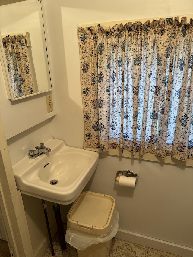 bathroom with toilet and sink