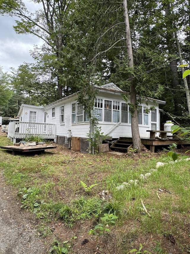 rear view of house with a deck