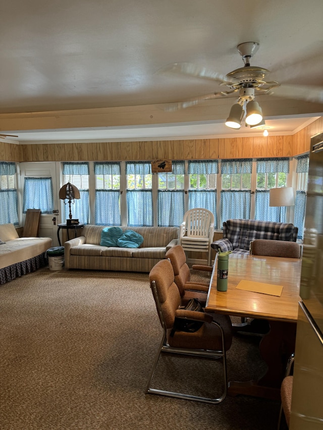 interior space with ceiling fan, carpet flooring, and plenty of natural light