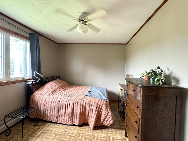 bedroom featuring ceiling fan and crown molding