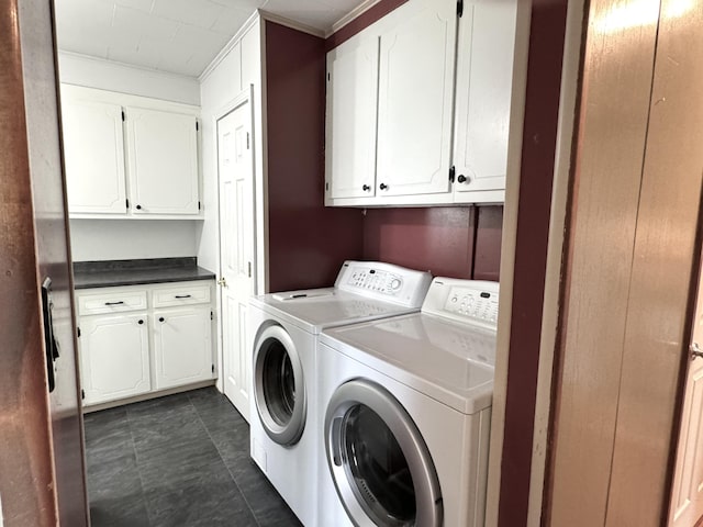 washroom featuring cabinet space and separate washer and dryer