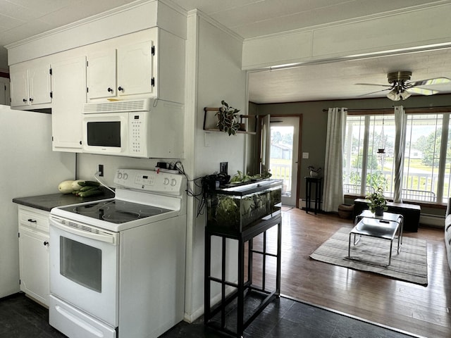 kitchen featuring white appliances, dark wood-style floors, white cabinets, and crown molding