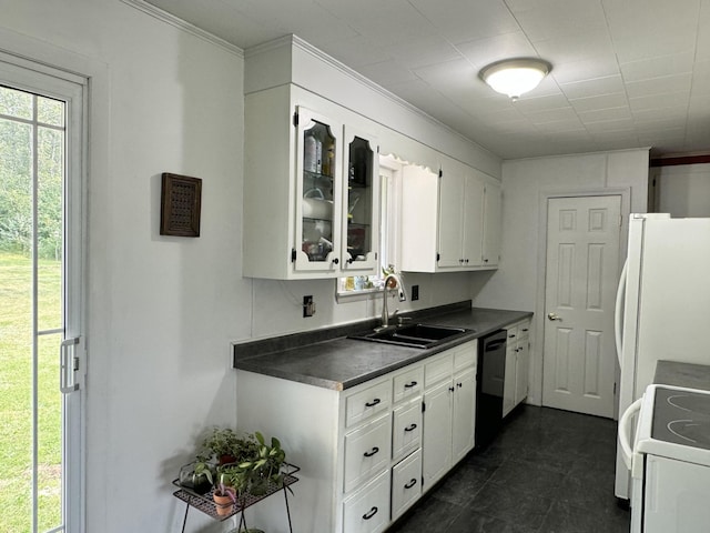 kitchen featuring white appliances, dark countertops, ornamental molding, white cabinetry, and a sink