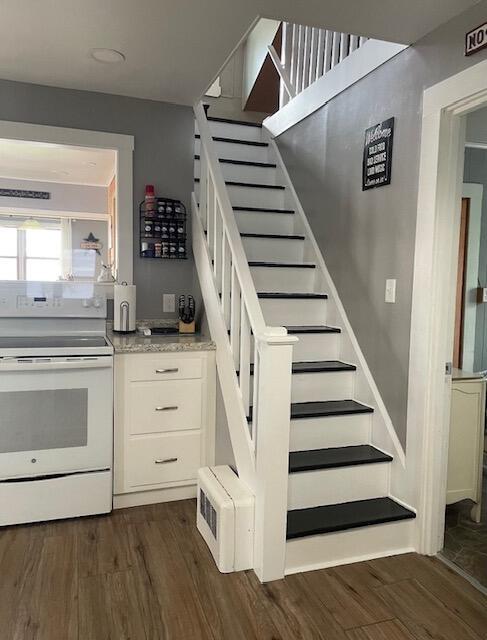 stairs with wood finished floors