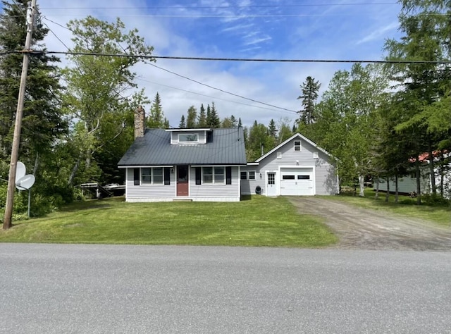 view of front of home featuring a garage, dirt driveway, a chimney, metal roof, and a front lawn