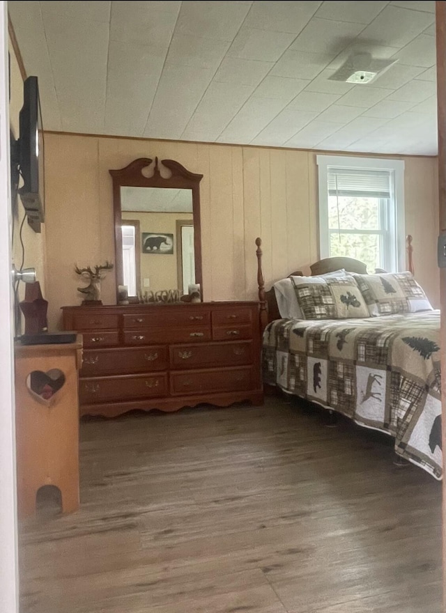 bedroom featuring wood finished floors