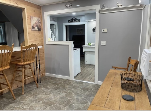 dining room with wooden walls