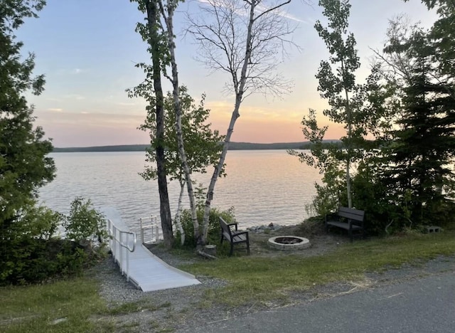 water view featuring an outdoor fire pit