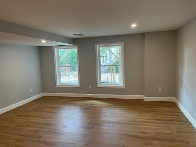 unfurnished room featuring light hardwood / wood-style floors