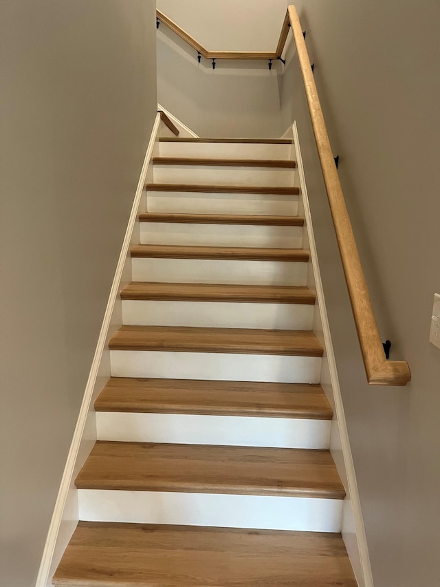 staircase featuring hardwood / wood-style flooring