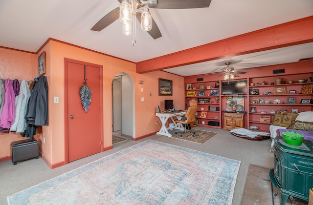 65 Harmony Hills Rd, Readfield, ME 04355 - interior space featuring arched walkways, carpet floors, ceiling fan, and ornamental molding