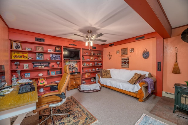 65 Harmony Hills Rd, Readfield, ME 04355 - carpeted office featuring visible vents, a ceiling fan, a baseboard heating unit, and a wood stove