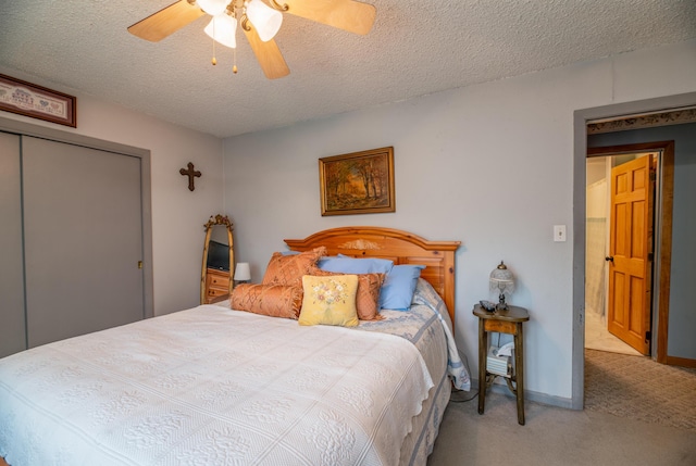 65 Harmony Hills Rd, Readfield, ME 04355 - bedroom with a ceiling fan, baseboards, carpet, a closet, and a textured ceiling