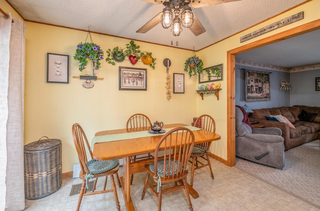 65 Harmony Hills Rd, Readfield, ME 04355 - dining space featuring visible vents, a textured ceiling, ceiling fan, and ornamental molding