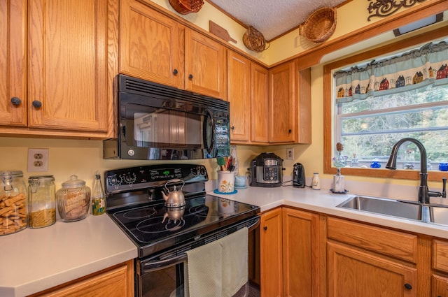 65 Harmony Hills Rd, Readfield, ME 04355 - kitchen with a sink, black appliances, and light countertops