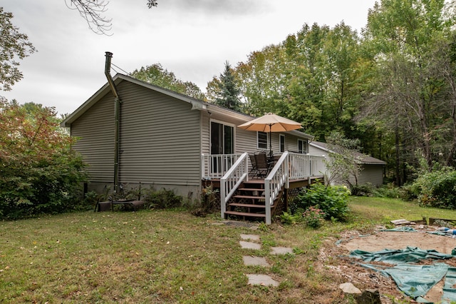 65 Harmony Hills Rd, Readfield, ME 04355 - rear view of property featuring a yard and a deck