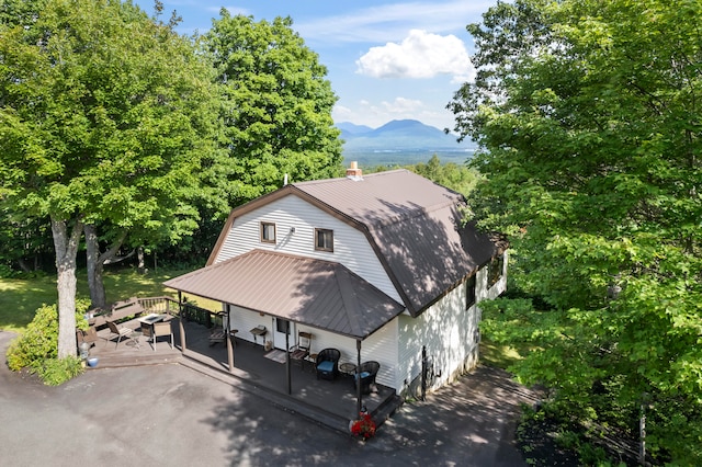 birds eye view of property with a mountain view