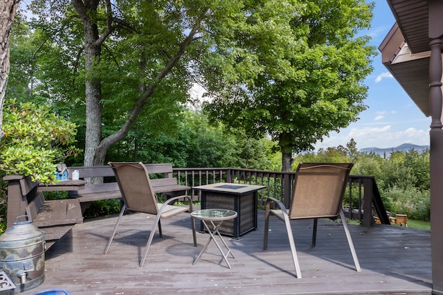 wooden deck featuring a mountain view