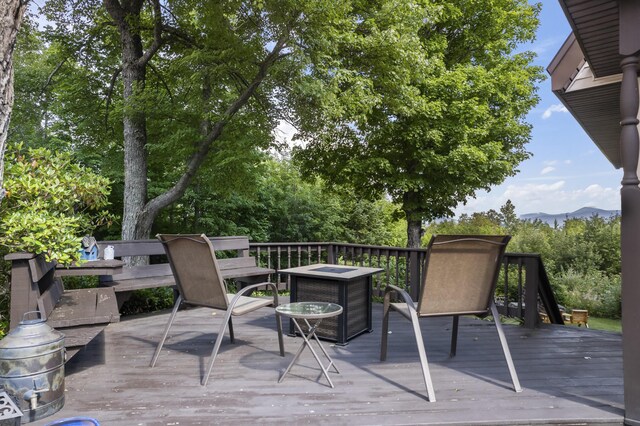 wooden terrace featuring a mountain view