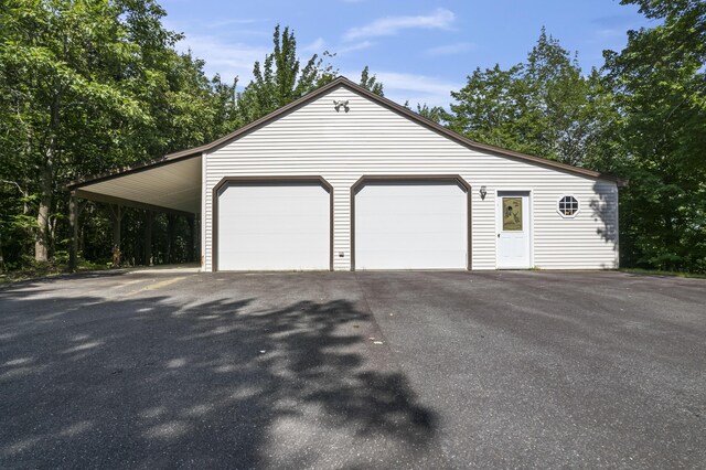 garage featuring a carport