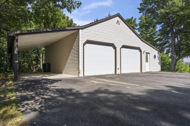 garage featuring a carport