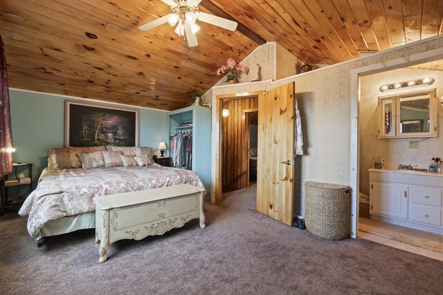 carpeted bedroom with a walk in closet, wood ceiling, vaulted ceiling, ceiling fan, and a closet