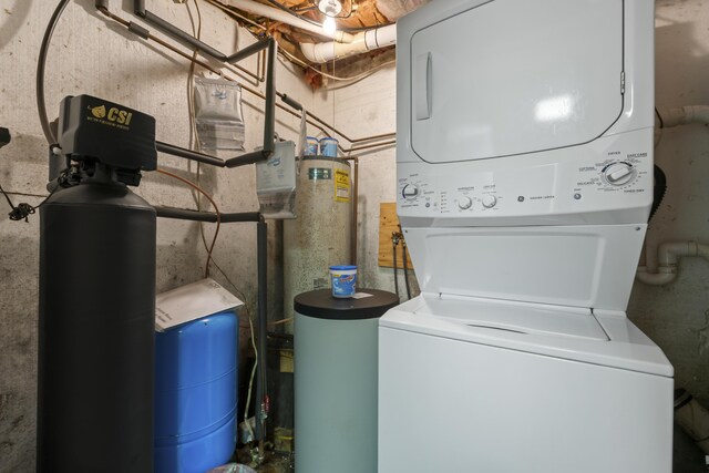 laundry area with stacked washing maching and dryer