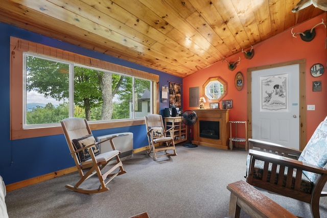 living area with carpet, lofted ceiling, and wood ceiling