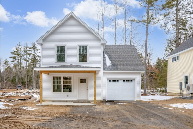 front facade with a porch and a garage