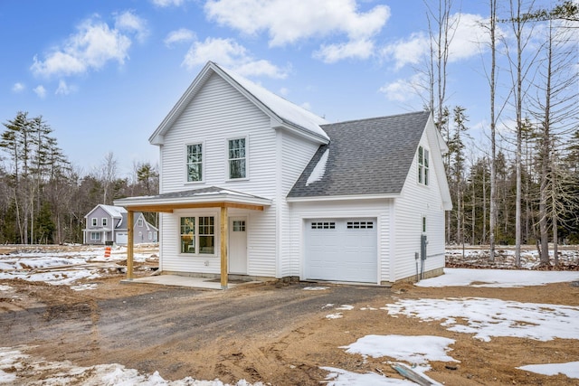 view of front property with a garage and covered porch